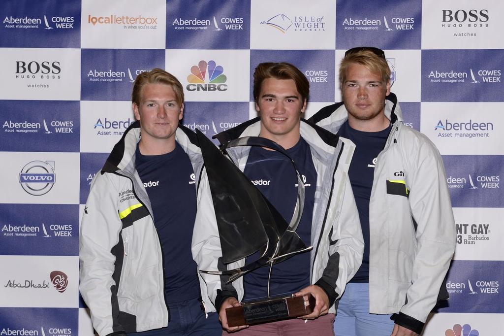 Jugador skipper Jack Davies (L) and his crew pick up the Under 25 Trophy in Aberdeen Asset Management Cowes Week 2014 © Aberdeen Asset Management